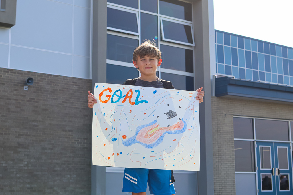 CVI student holding sign supporting Vikings