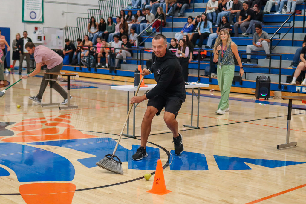 Staff member playing assembly game