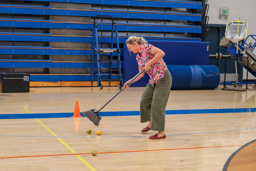 Staff member playing assembly game