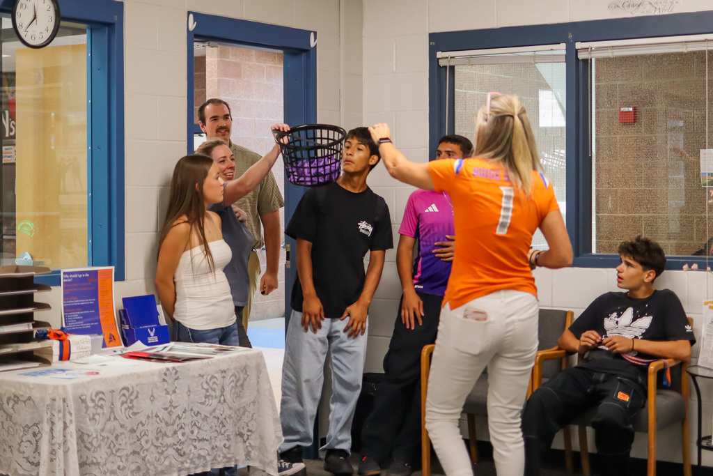 Students and staff delivering paper cranes to office