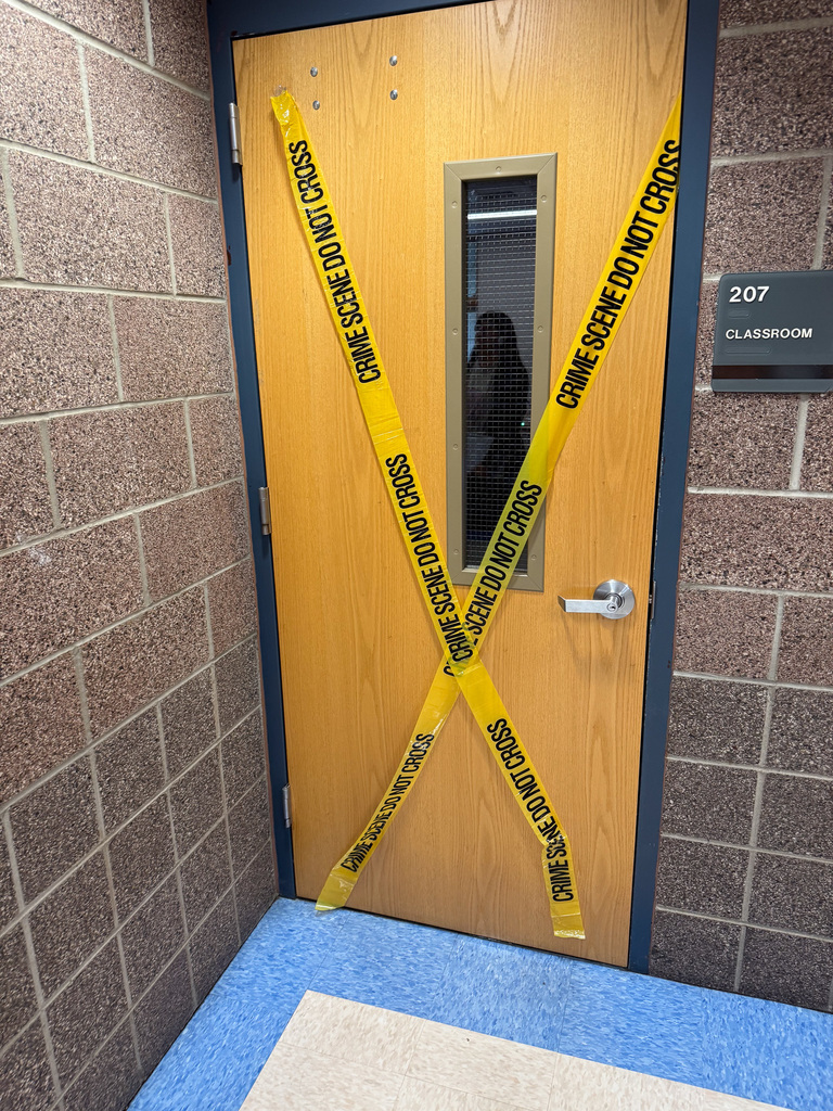 classroom door taped with crime scene tape