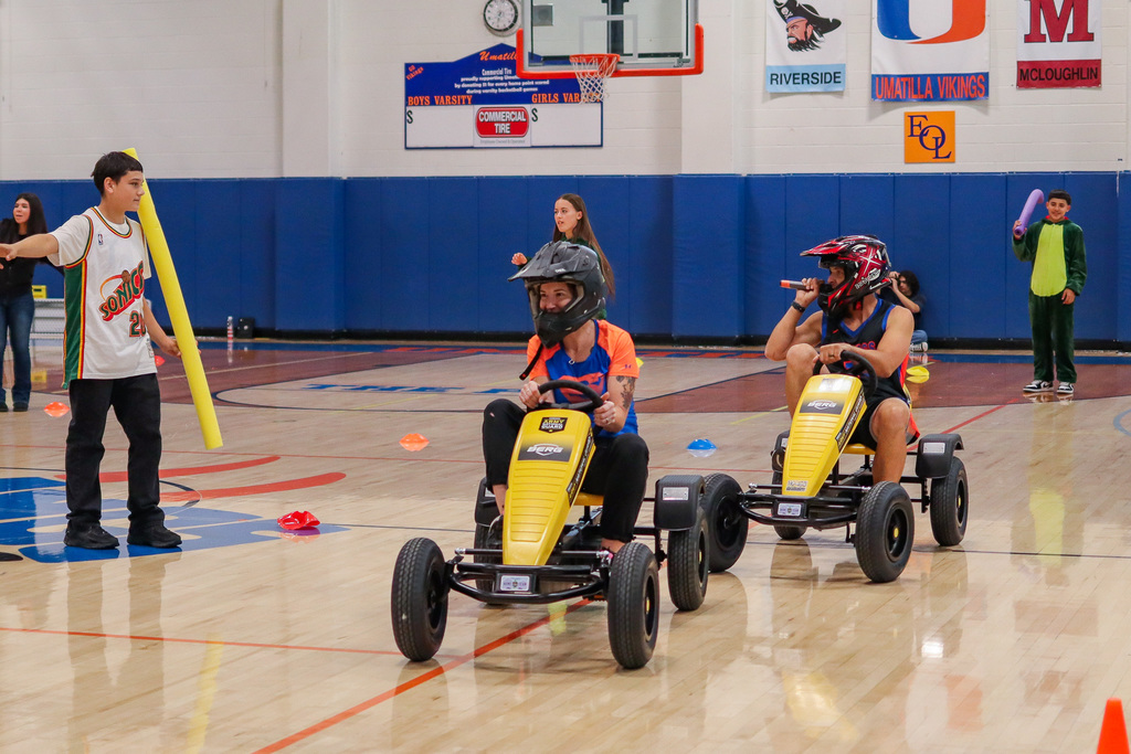 photo of staff racing on pedal bikes