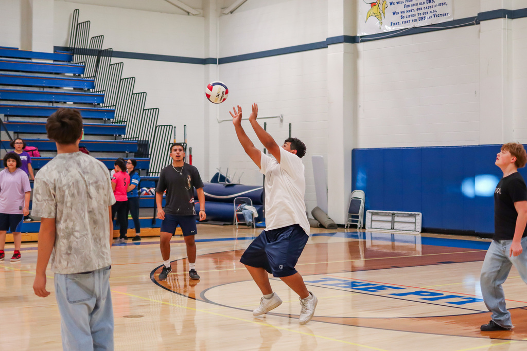 Students playing mens volleyball