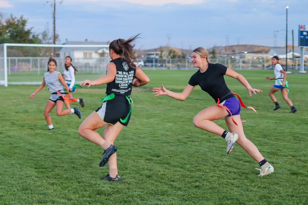 students playing powder puff football