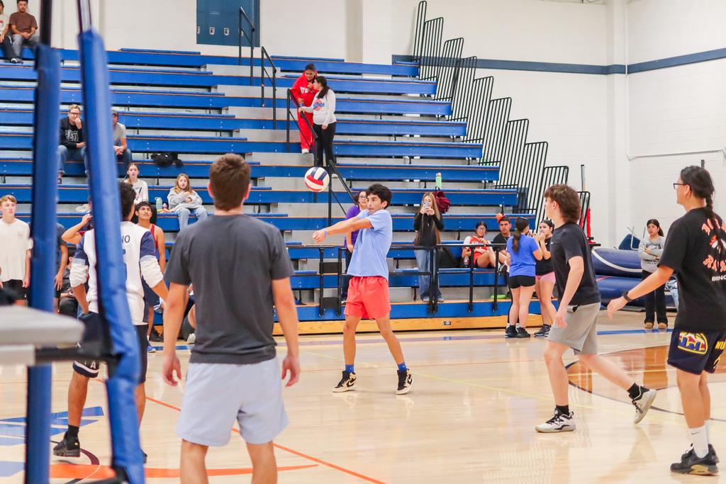 Students playing mens volleyball