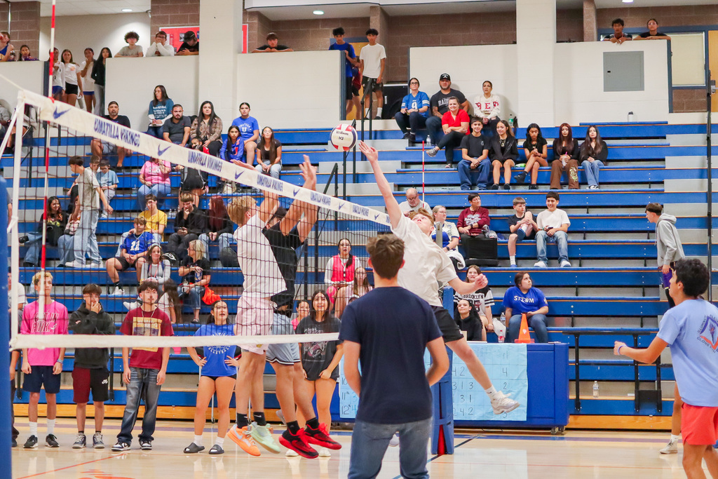 Students playing mens volleyball