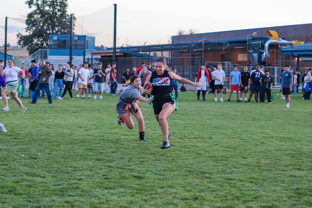 students playing powder puff football
