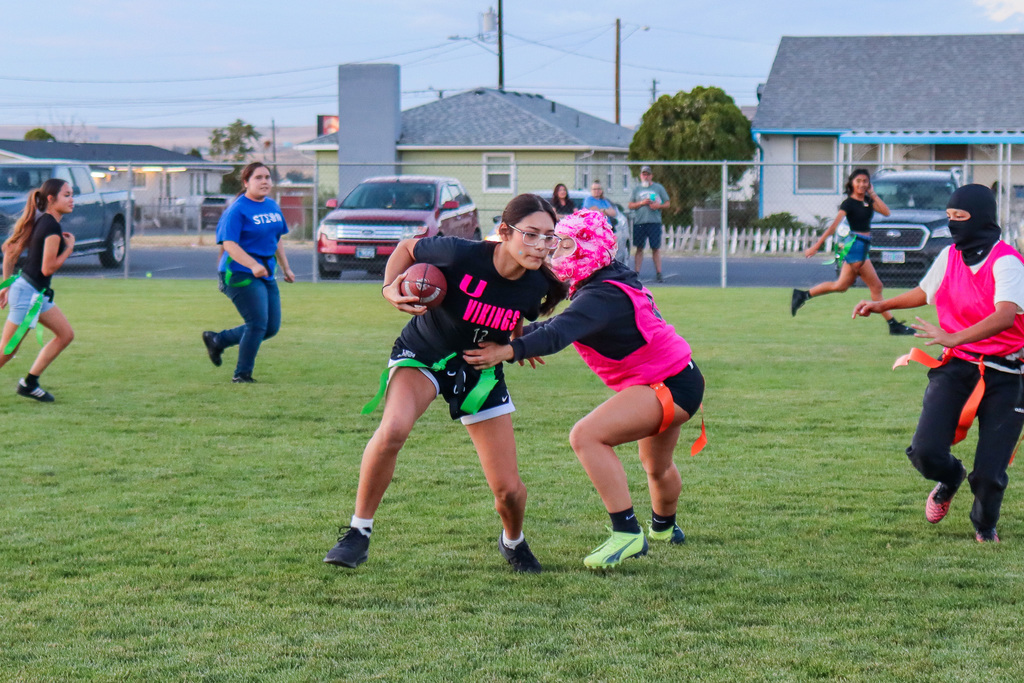students playing powder puff football