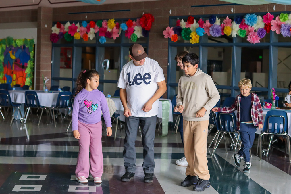 students with family dancing