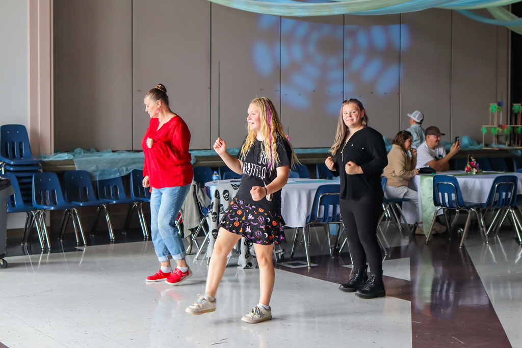 students with family dancing
