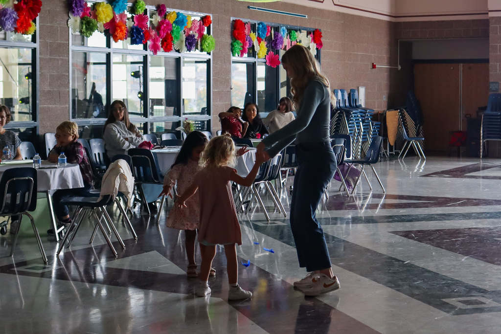 students with family dancing