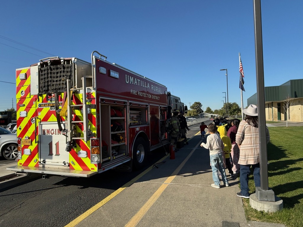 students learning about the different tools firefighters use