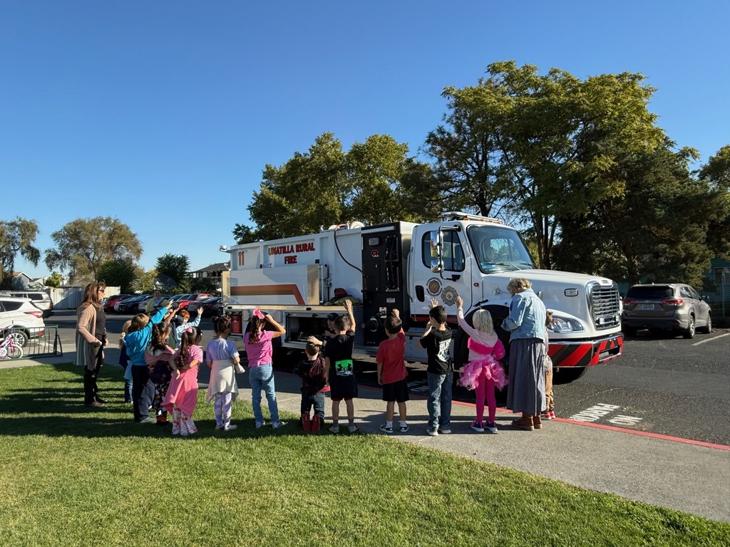 students asking the firefighters questions