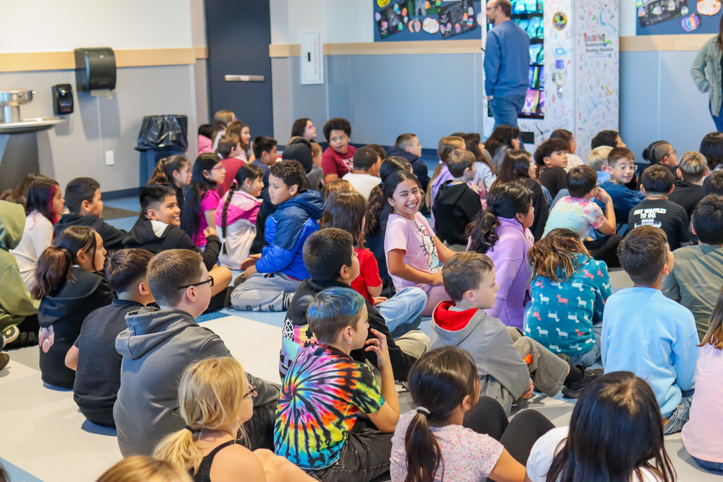 students excited for the ribbon cutting of the machine