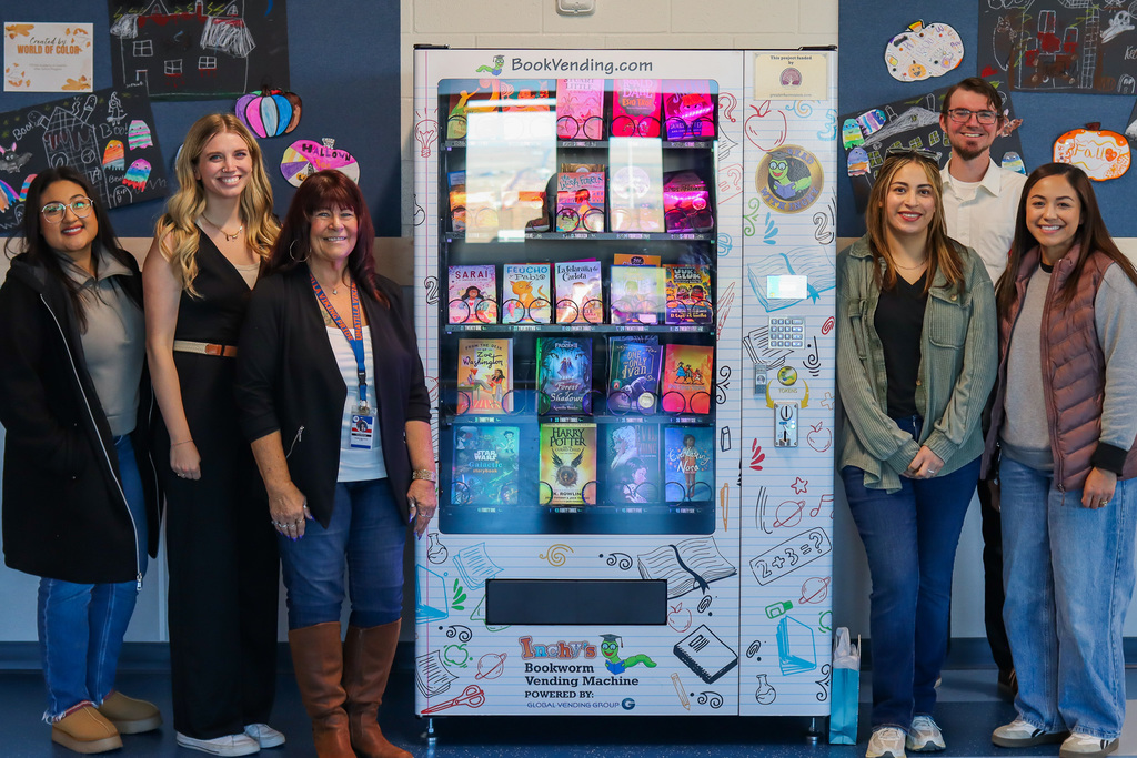 Photo of Parent Club, Board Member Josiah Barron, and Vice Principal Kara Church with the new machine