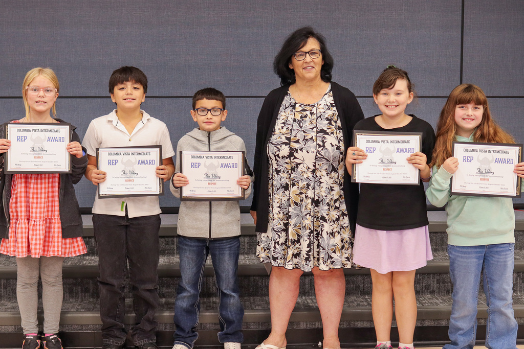 Ms. Estrella pictured with her REP Award Winners