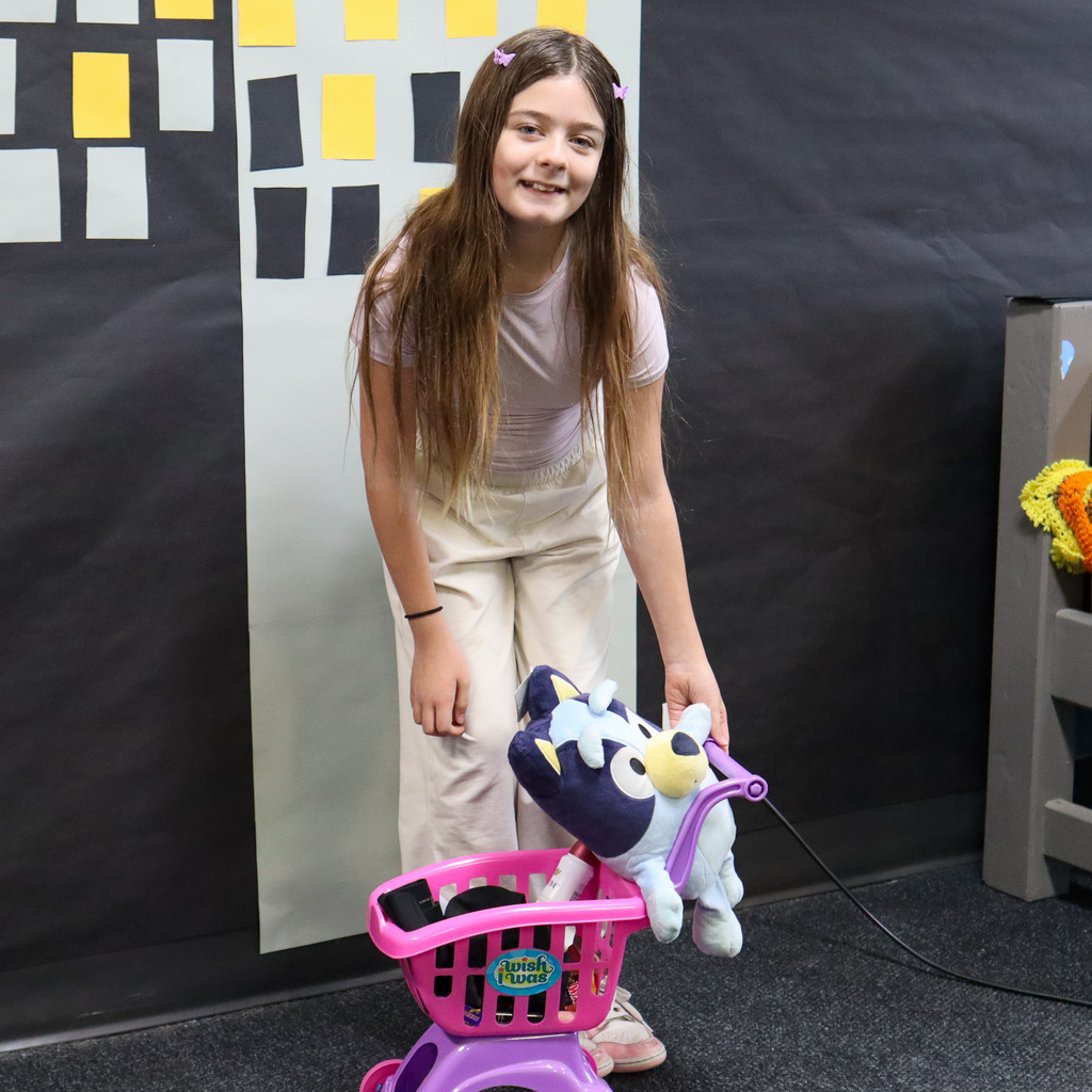 Student with a mini grocery cart