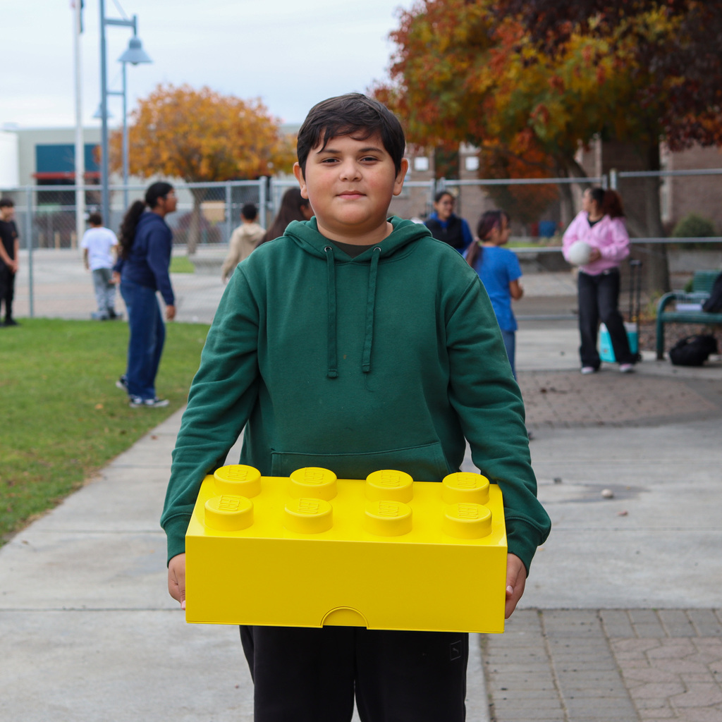 Student with a lego storage container
