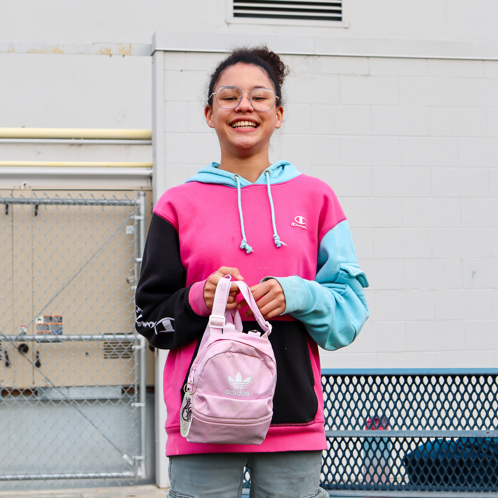 Student with a mini backpack