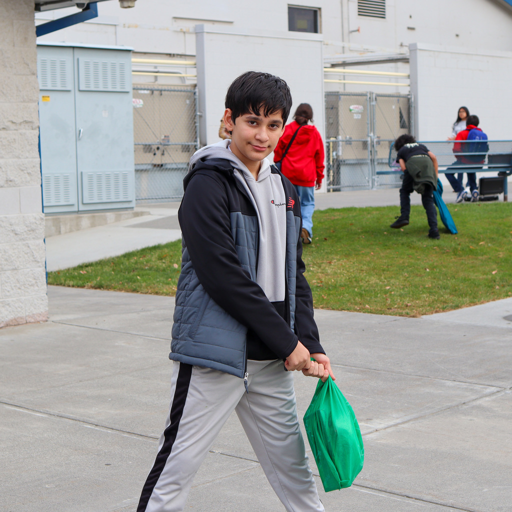Student with a green pillow case