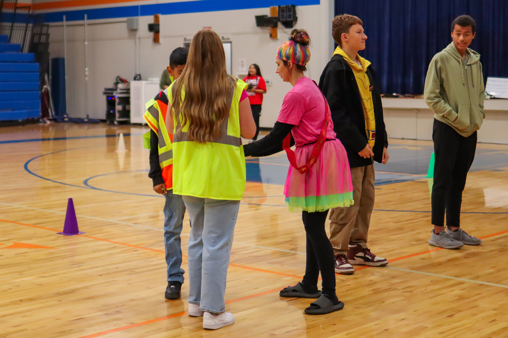 students participating in assembly game
