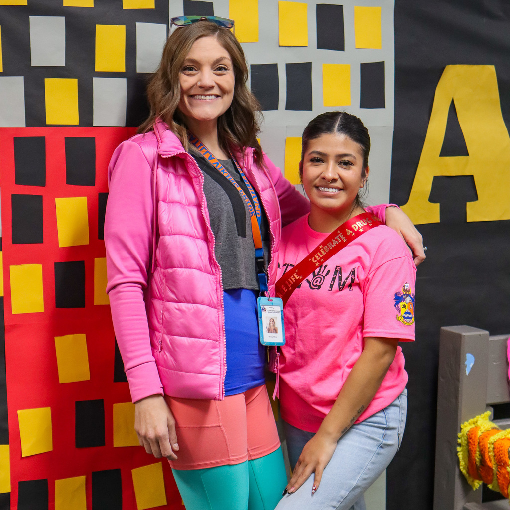 Staff dressed up wearing neon