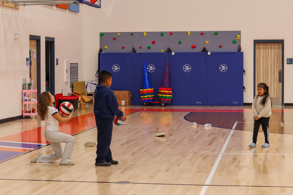 students playing volleyball