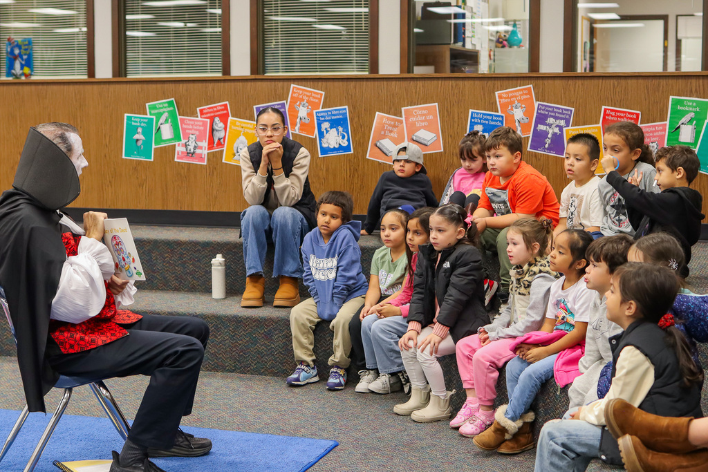 Mr. Lougee reading to the students 