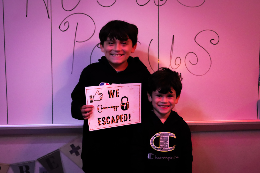 photo of kids who successfully escaped the escape room