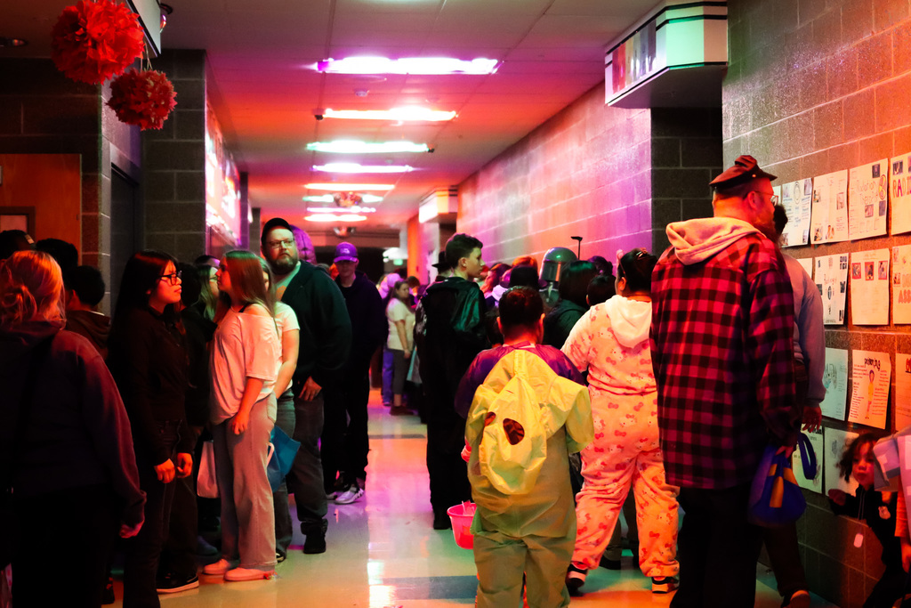 photo of families in the hall waiting to go in the haunted rooms 