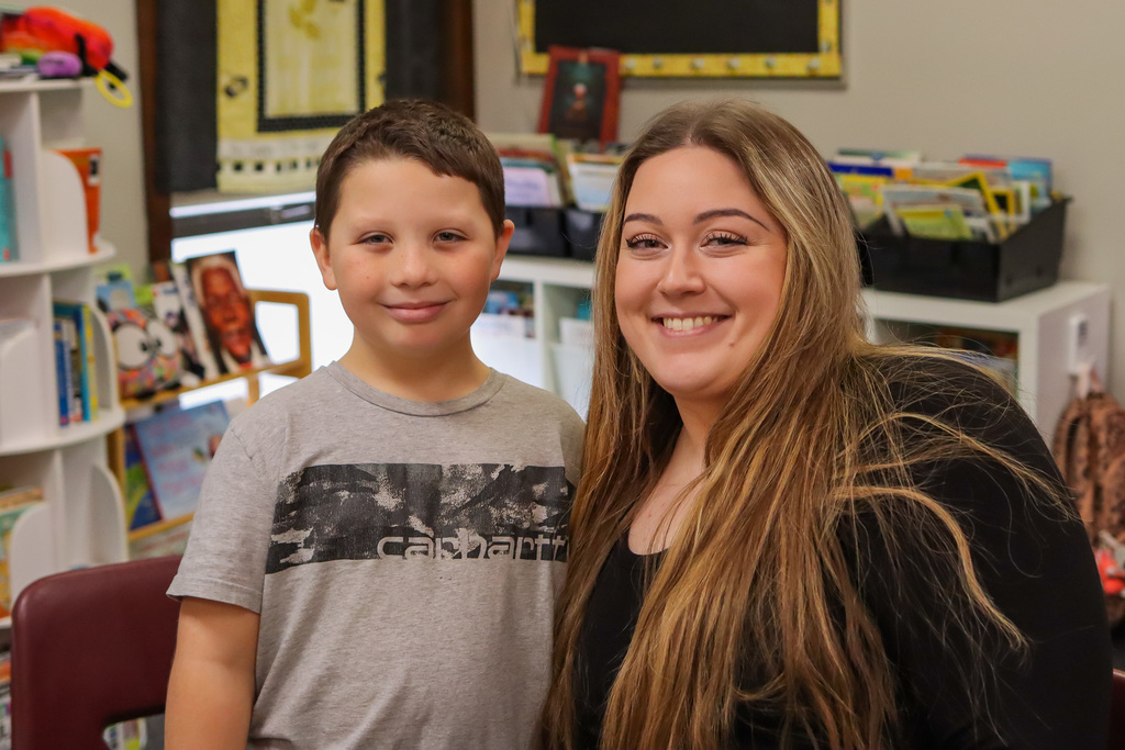 Photo of student with family at Thanksgiving Feast