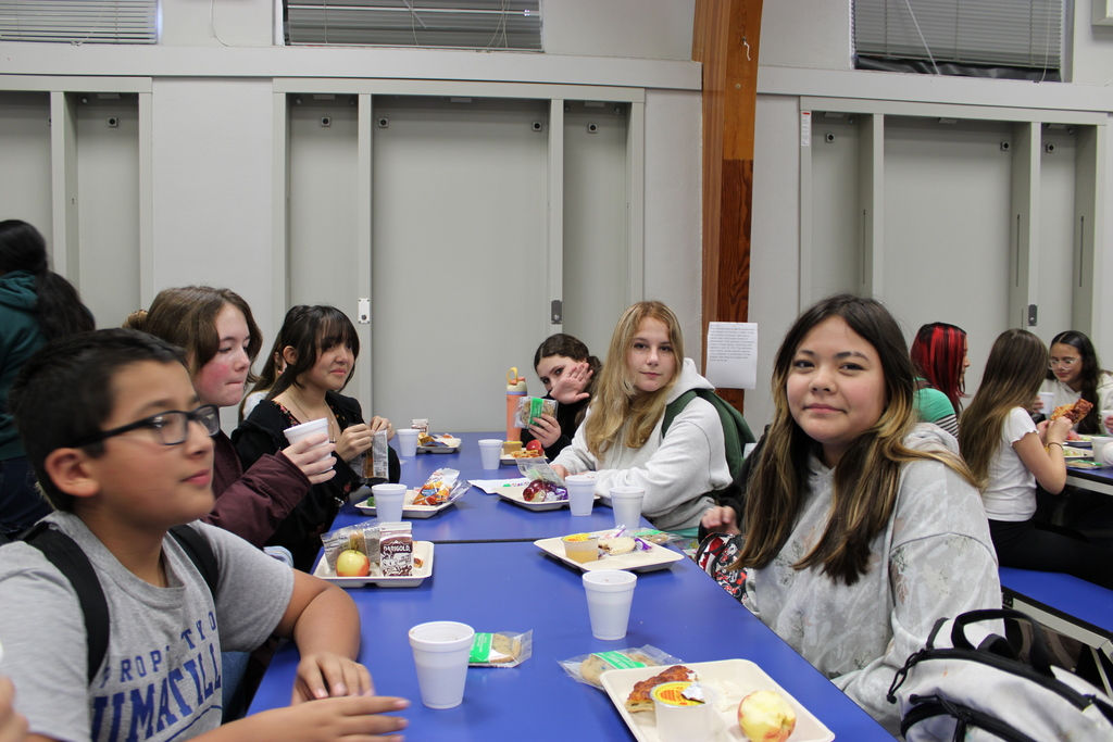 students enjoying cookies and hot chocolate 