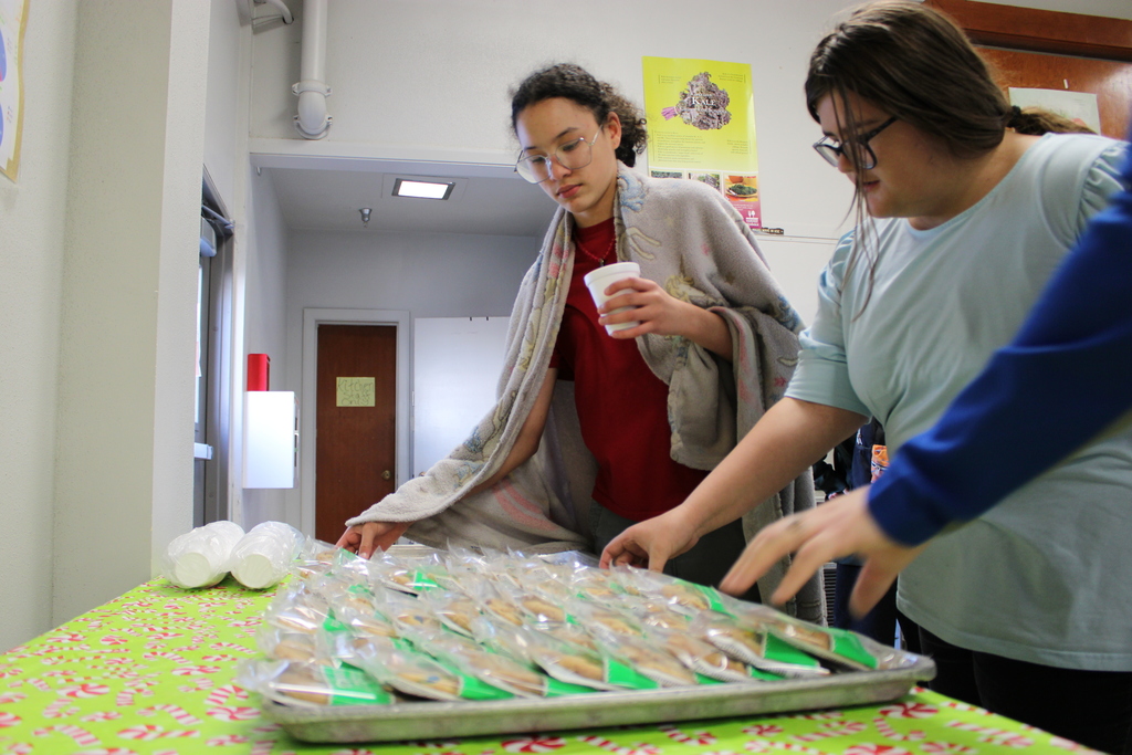 students enjoying cookies and hot chocolate 