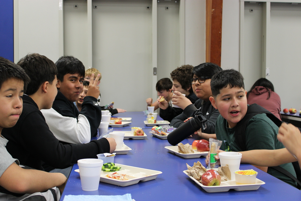 students enjoying cookies and hot chocolate 