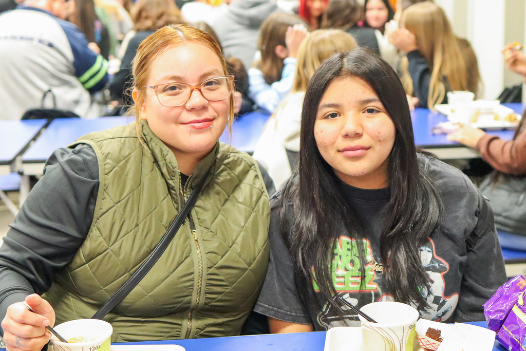 photo of student with family at Thanksgiving Feast 