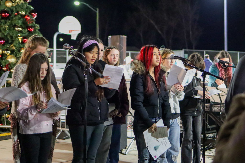 photo of middle school students singing