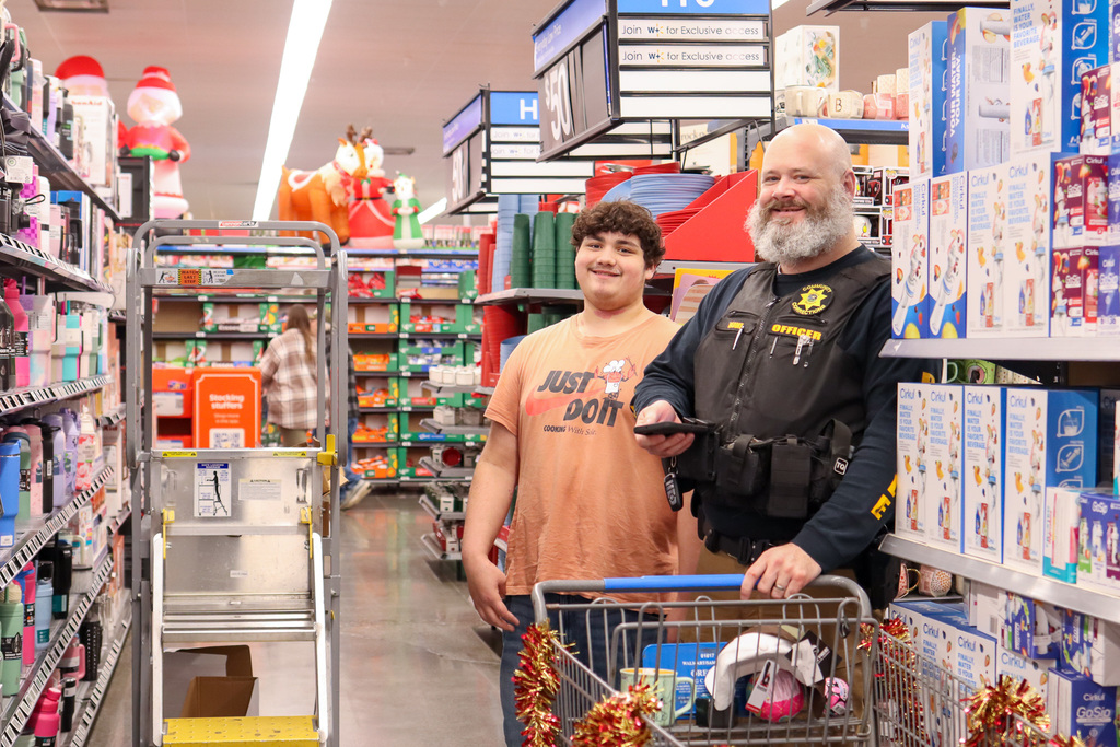 police officer and student shopping 