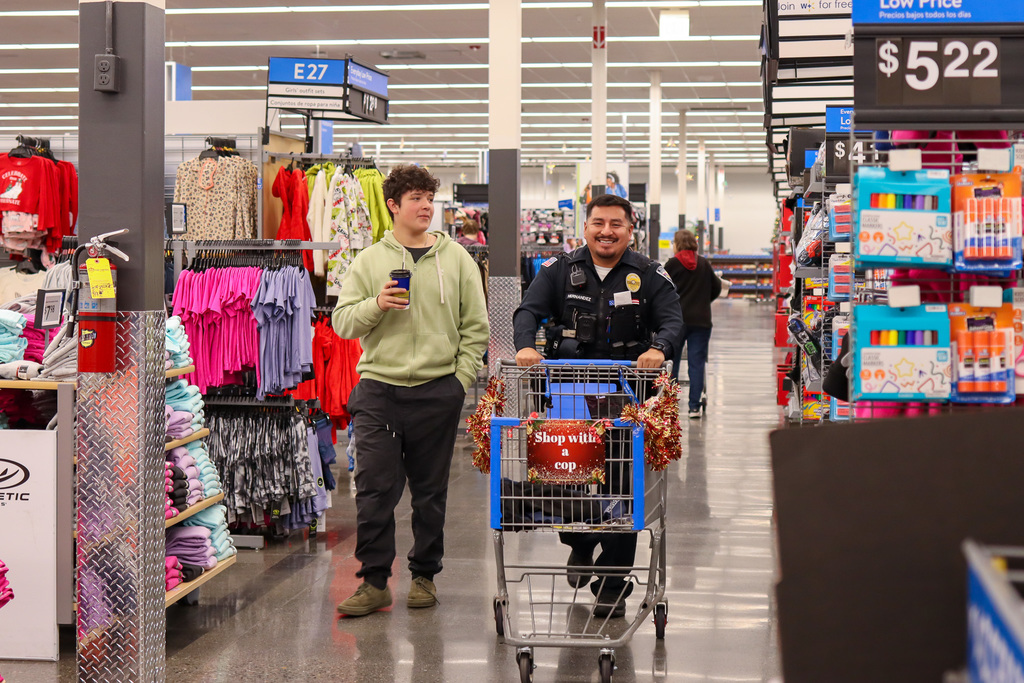 Police officer and student shopping 