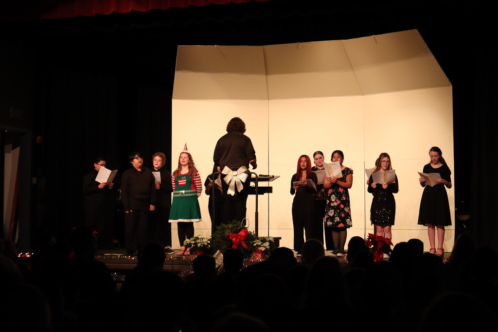 photo of middle school students singing 