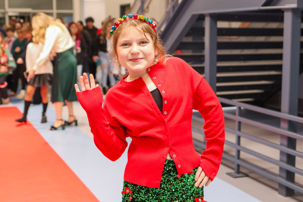 student taking a photo on the red carpet 