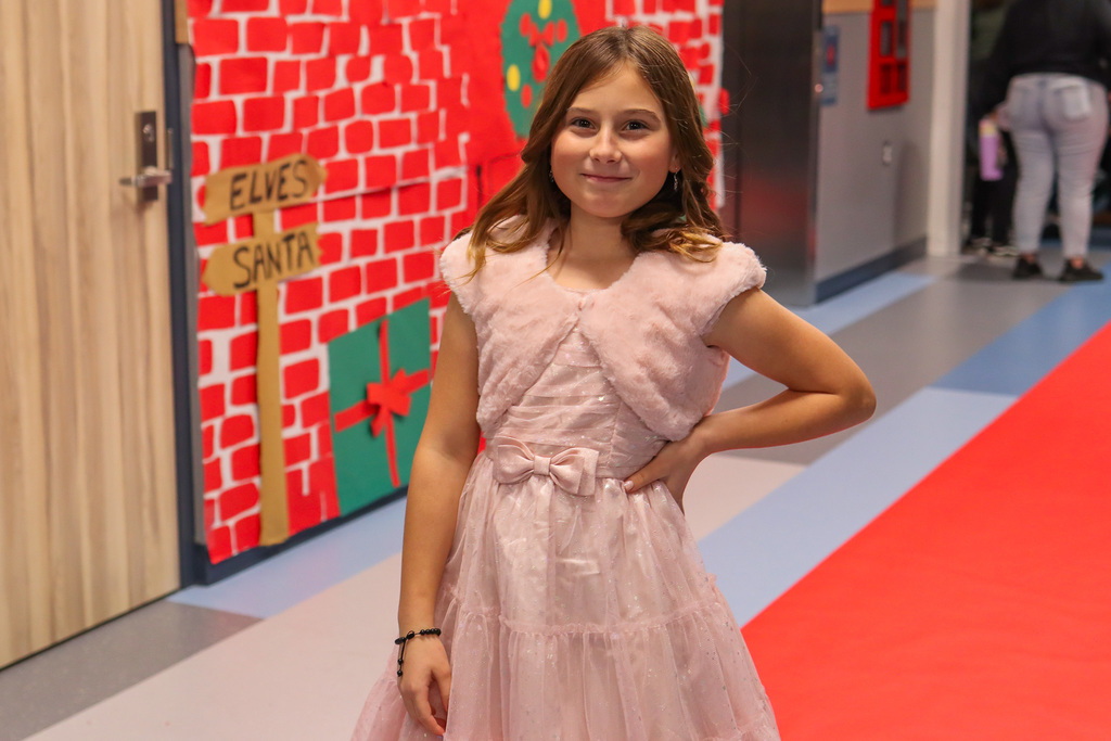 student taking a photo on the red carpet 