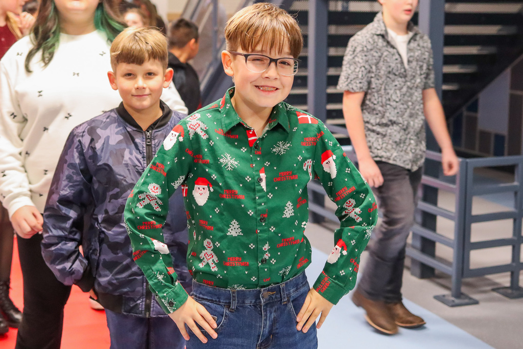 student taking a photo on the red carpet 