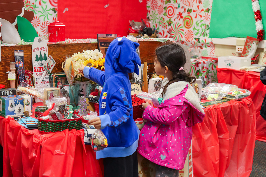 students picking out gifts at the Little Angel Shop