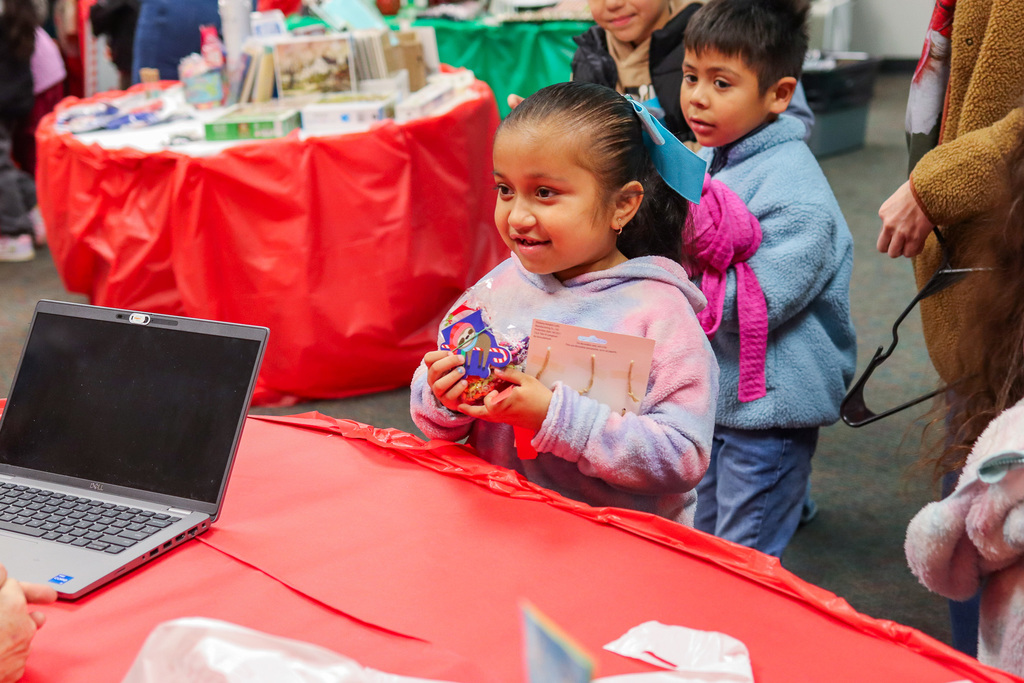 students picking out gifts at the Little Angel Shop