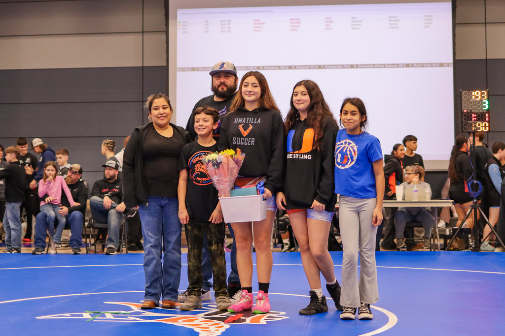 photo of senior wrestler with family