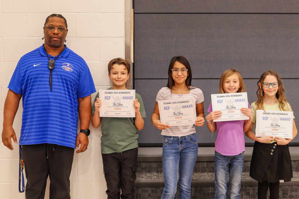 Photo of REP Award winners with their teacher