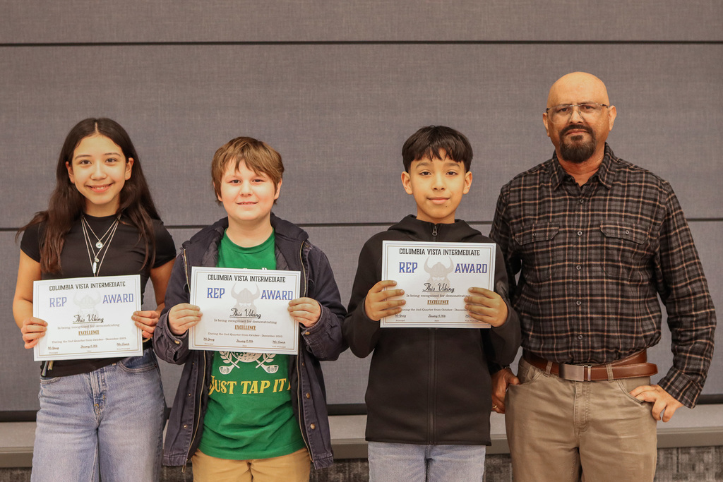 Photo of REP Award winners with their teacher