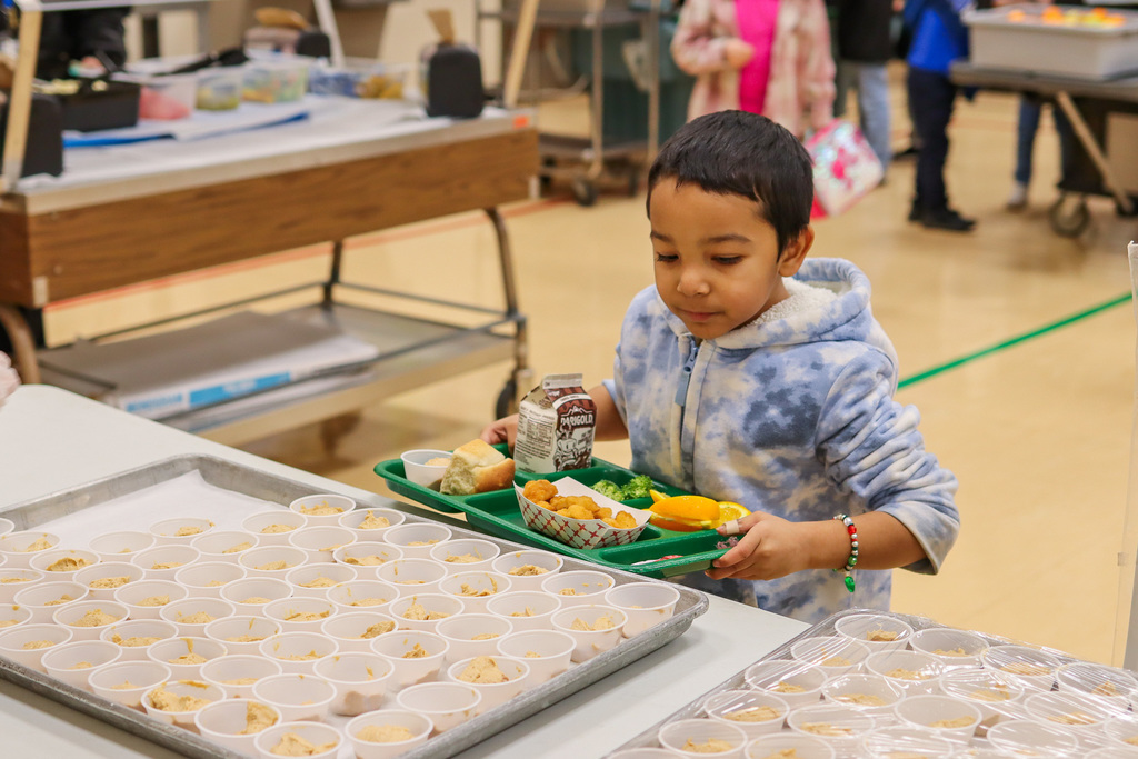student looking at peanut butter yogurt sample