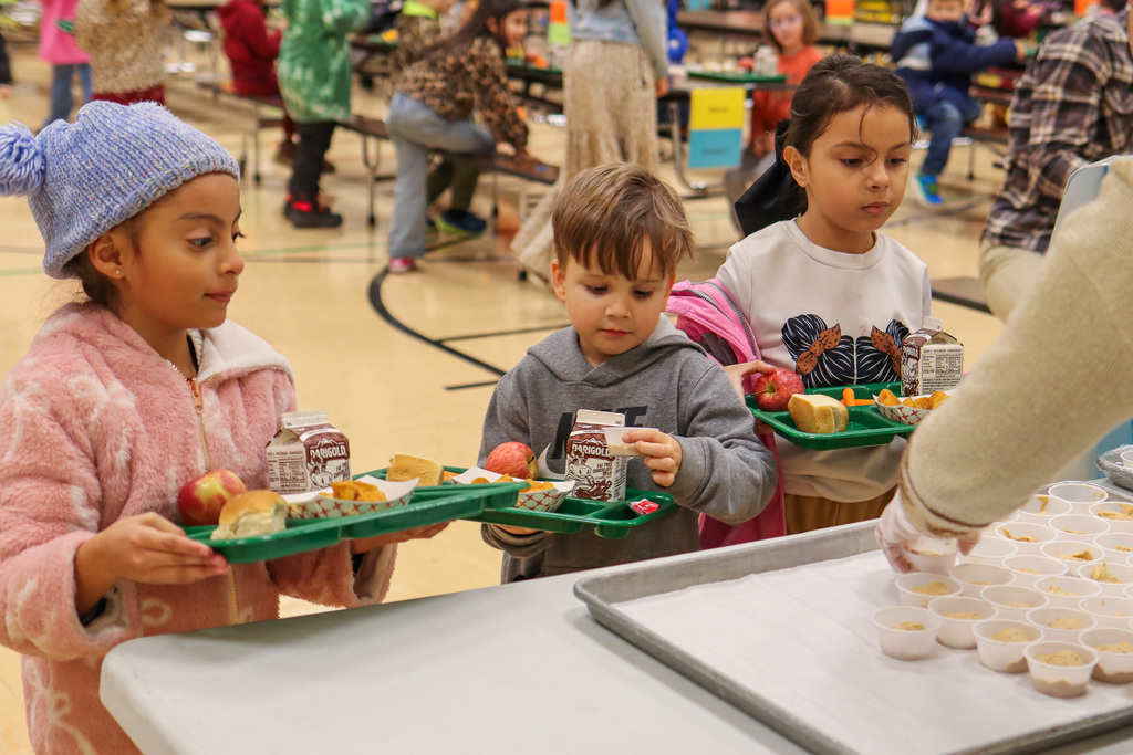 students looking at peanut butter yogurt sample