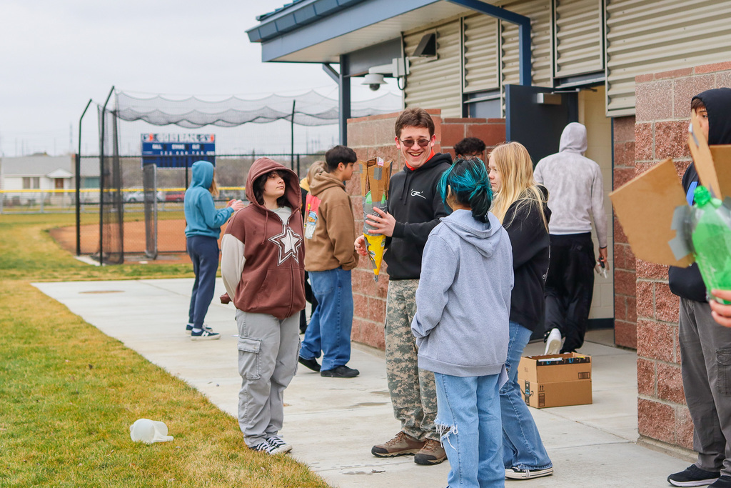 students waiting to launch rockets